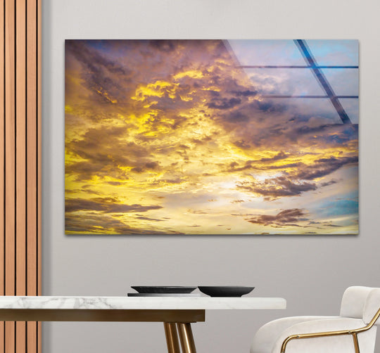 Evoking the abstract quality of a dreamscape, this golden cloudscape wall art offers unique modern wall decor through its tranquil sunset sky print's ethereal composition.