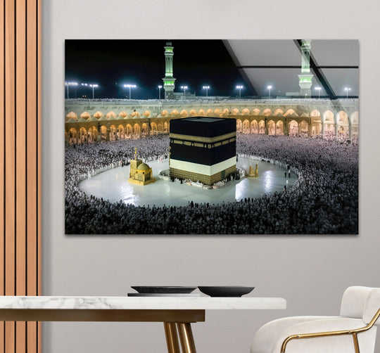 Negative space frames the Kaaba Mecca wall art, a sacred Islamic print, highlighting the depth and detail of this radiant glass art featuring Masjid al-Haram at night.