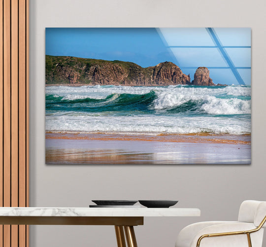 Showcasing the layering effect, this scenic beach glass print features the hanging wall art of a rocky coastline with ocean waves.
