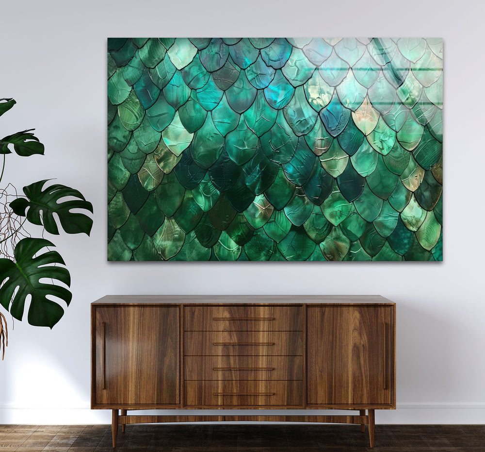 An abstract green glass printing features a mesmerizing emerald scale texture, with iridescent teal and aquamarine hues on the wall art.