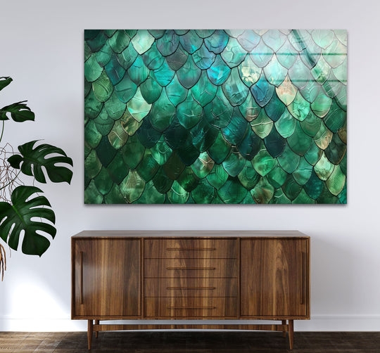 An abstract green glass printing features a mesmerizing emerald scale texture, with iridescent teal and aquamarine hues on the wall art.