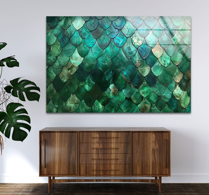 An abstract green glass printing features a mesmerizing emerald scale texture, with iridescent teal and aquamarine hues on the wall art.