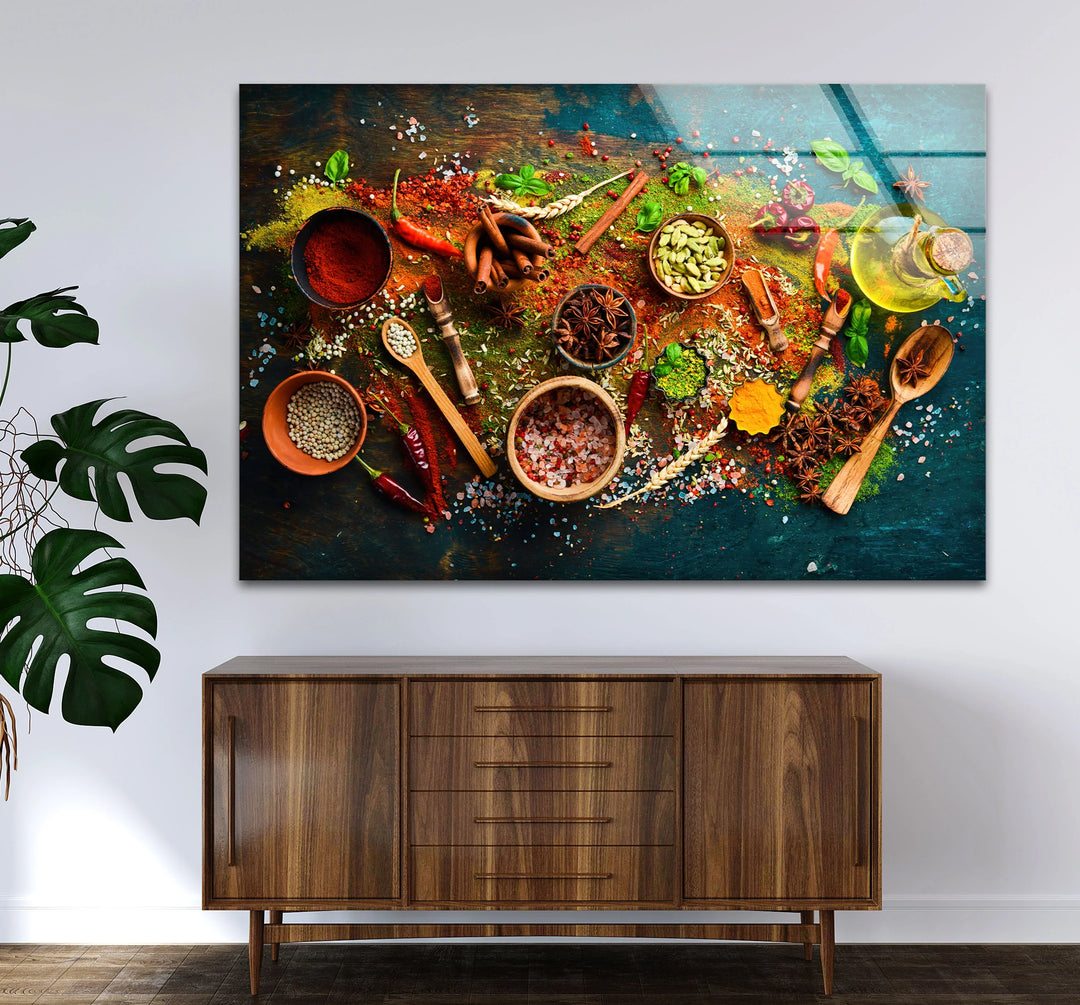 Highlighted by the powders of spice, this kitchen glass print wall art features an assortment of colorful spices and herbs in a rustic, inviting display.