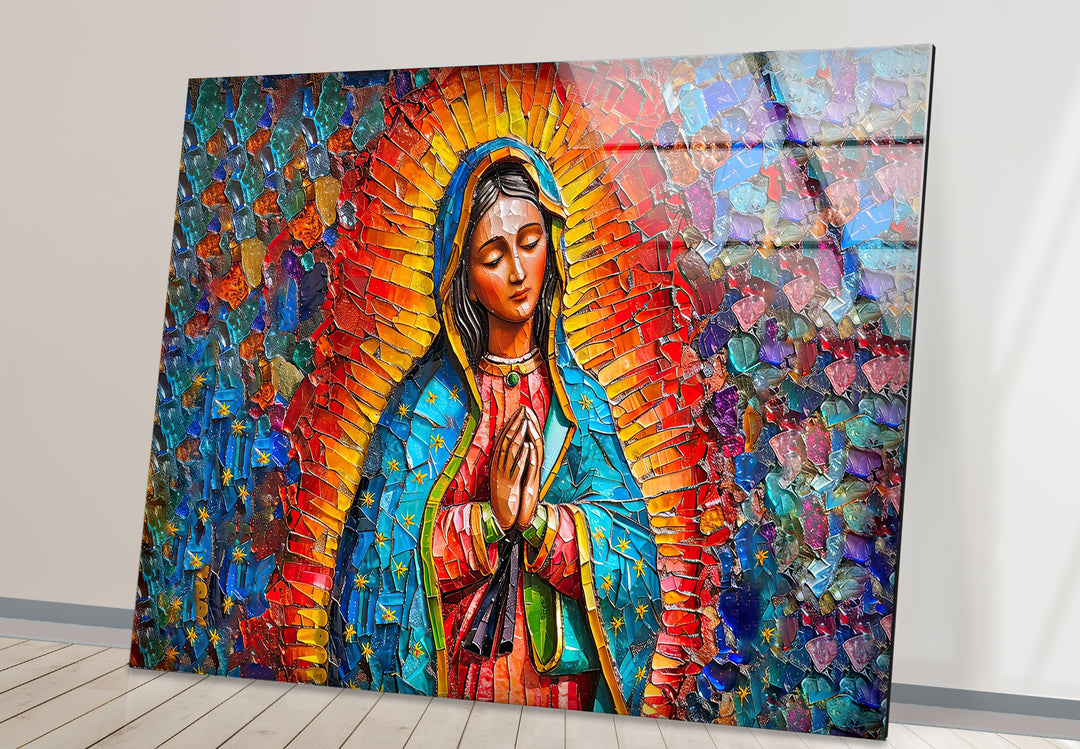 The profound stillness of the praying Virgin Mary radiates from this intricate mosaic glass wall artwork, featuring vibrant, jewel-toned patterns.