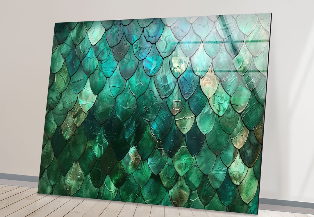 Organic forms of shimmering emerald scales create a textured abstract green glass wall art for modern home decor.