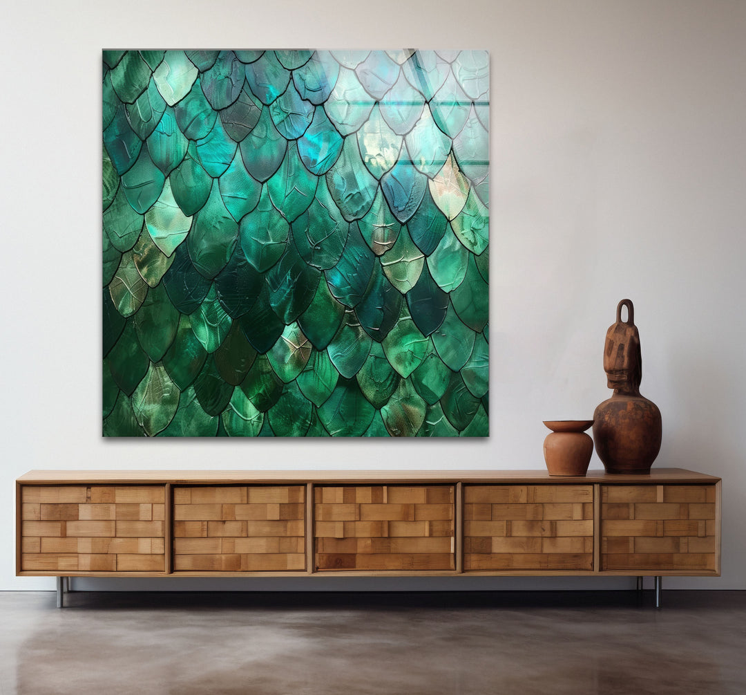 Light and shadow interplay across the shimmering emerald scale texture of this abstract art from glass, highlighting its deeply saturated hues.