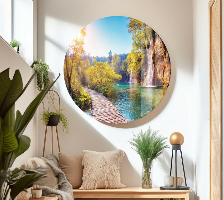 Nature paintings for sale featuring a picturesque wooden trail over shimmering blue waters.
