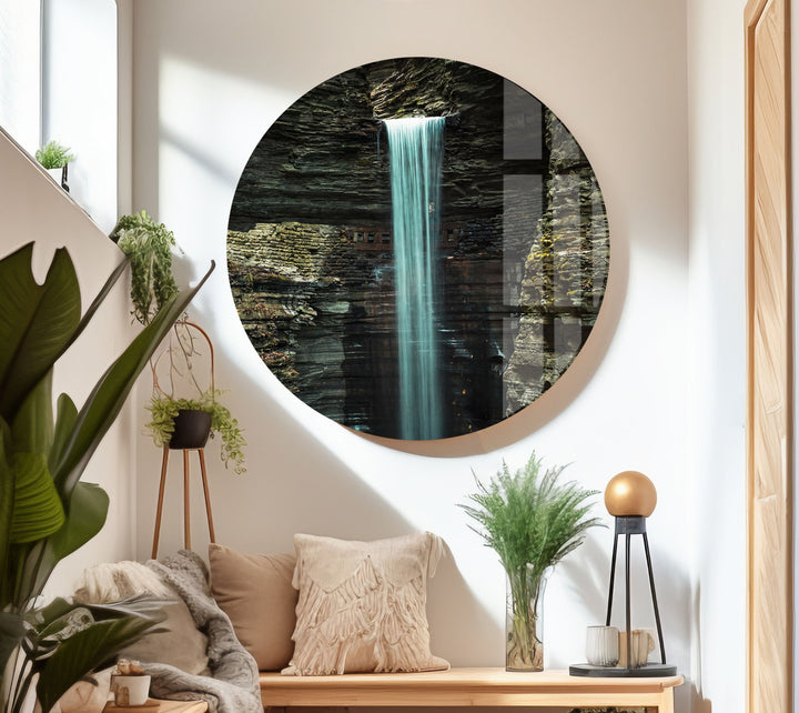 Captivating glass wall art featuring a mesmerizing waterfall surrounded by rocky cliffs.
