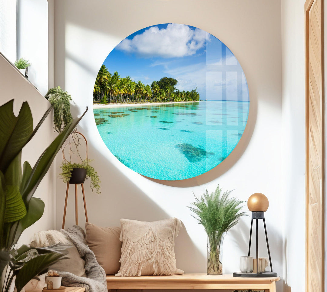 Panoramic seascape with coral reefs visible beneath crystal-clear ocean waters.
