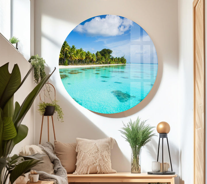 Panoramic seascape with coral reefs visible beneath crystal-clear ocean waters.
