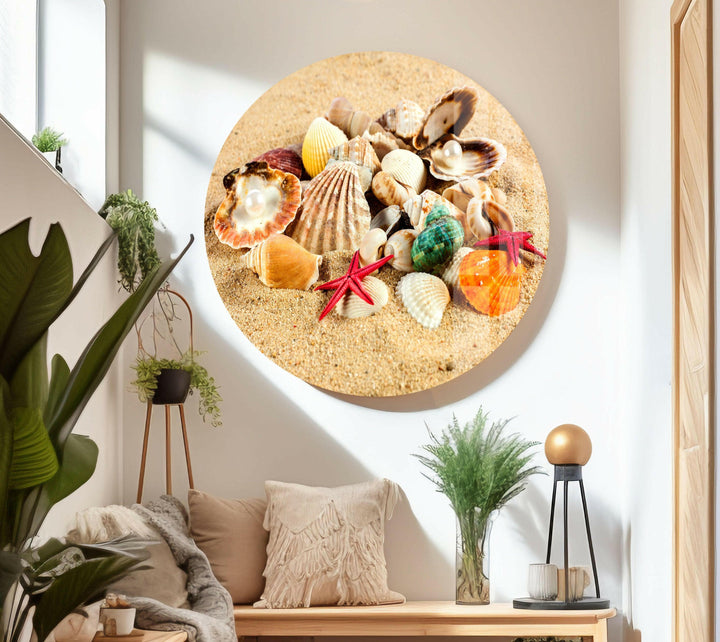 Seashells and red starfish arranged on fine sand, evoking a peaceful coastal atmosphere.
