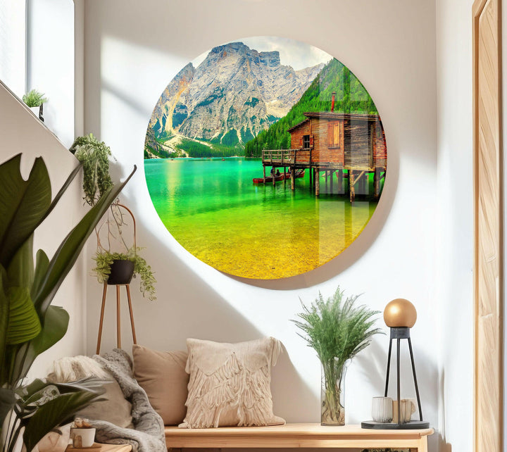 Landscape art featuring a mesmerizing turquoise lake and a charming wooden cabin.
