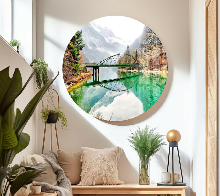 Landscape art featuring a crystal-clear river, a steel bridge, and autumn trees.
