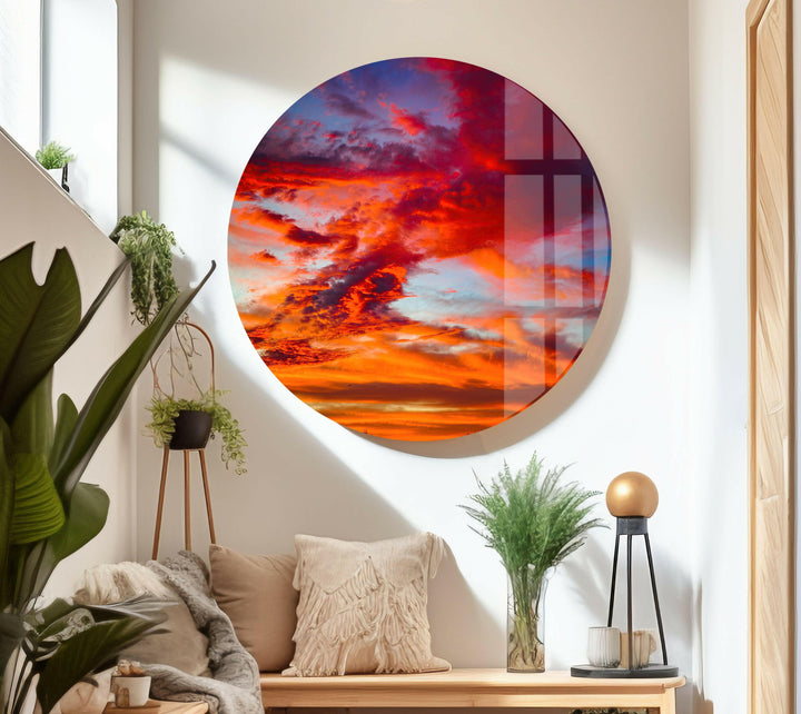 A magnificent blend of red, orange, and blue hues in a dramatic sunset sky.
