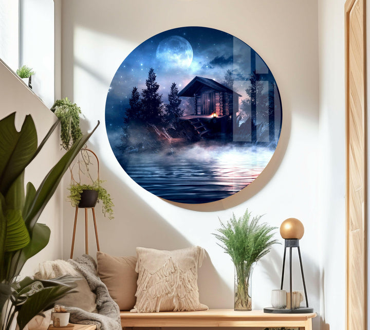 Tranquil glass wall art featuring a misty forest cabin beside a quiet lake.

