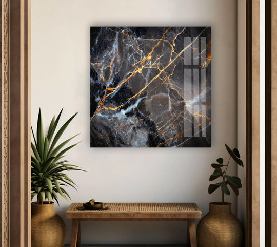 Dark gray marble with gold ink abstract glass wall art prints featuring a high-gloss finish.