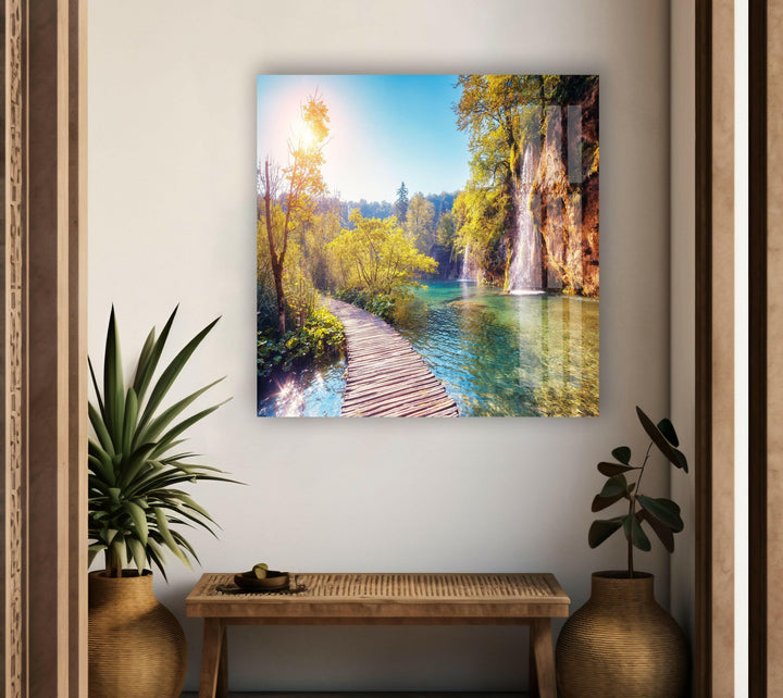 Landscape art for sale depicting the peaceful charm of Plitvice Lakes with reflections of golden sunlight.
