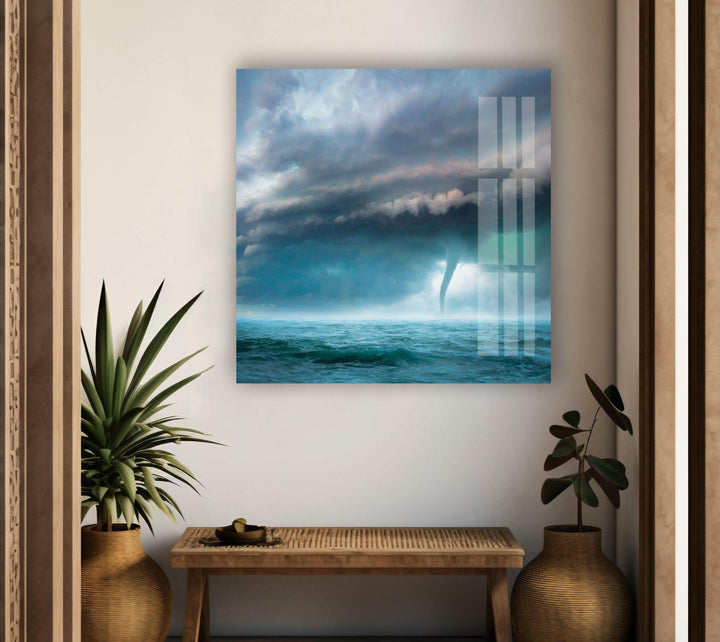 A turbulent seascape with storm clouds and a twisting waterspout.
