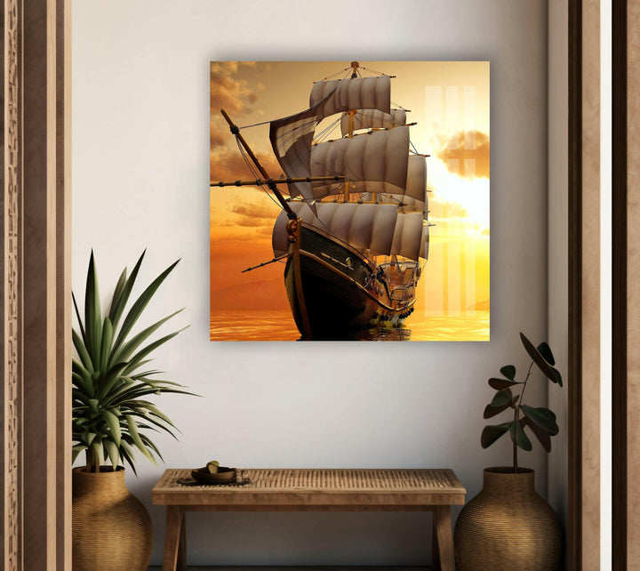 Maritime-inspired glass wall art showcasing a historic sailing vessel against a dramatic sky.
