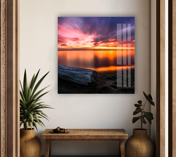 Fiery sky meeting the calm ocean, a stunning coastal landscape.
