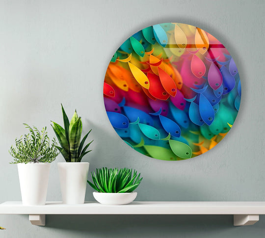 Horizontal, round tempered glass wall art featuring a vibrant school of rainbow fish creates an ocean-inspired, colorful, and visually captivating scene.