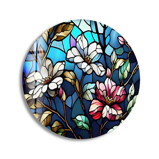Brightest white magnolia blooms illuminate the refined stained glass art design of this round glass wall art.