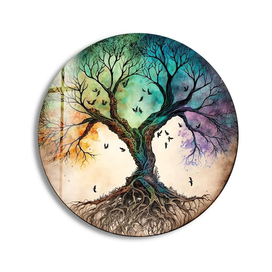 Negative space emphasizes the silhouette of a vibrant tree against a soft backdrop, highlighting this striking art from glass piece in a round wall decor.