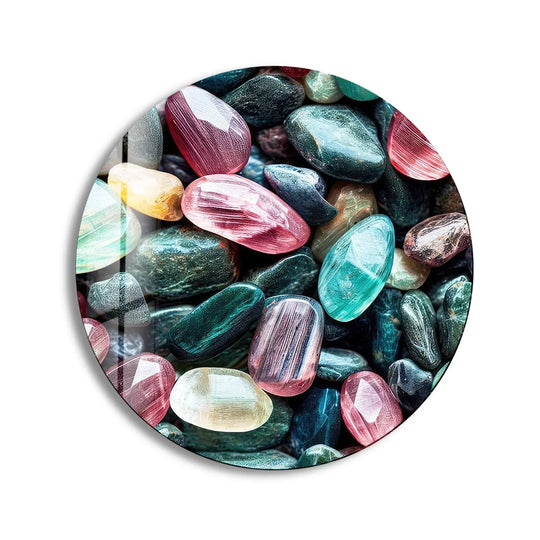 Highlighting the abstract quality, multicolored glass printing creates an intriguing display of zen spa stones in this round glass wall art.