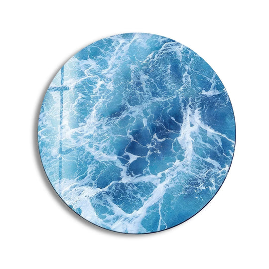 Round glass wall art shows blue ocean waves and makes coastal decor an elegant statement piece with its vibrant UV printing on tempered glass