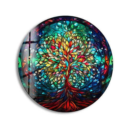 Negative space surrounds the tree of life in this round wall art from glass, highlighting the colorful stained glass design.