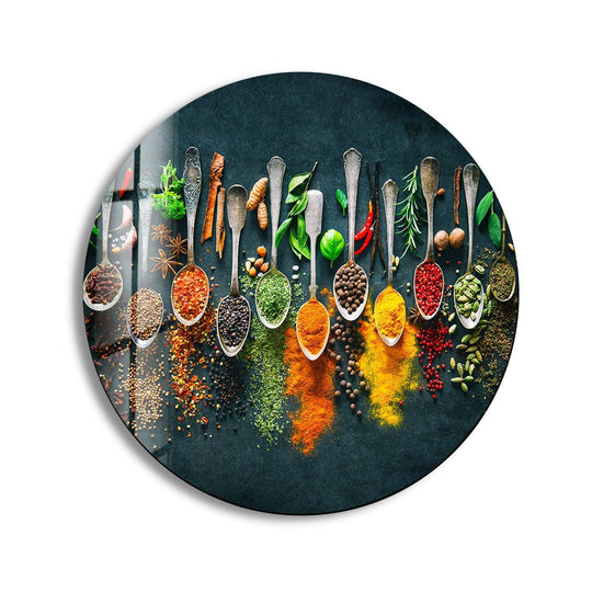 Abundant negative space surrounds the colorful herbs, allowing the vibrant details of the glass art round wall decor to stand out against the dark background.
