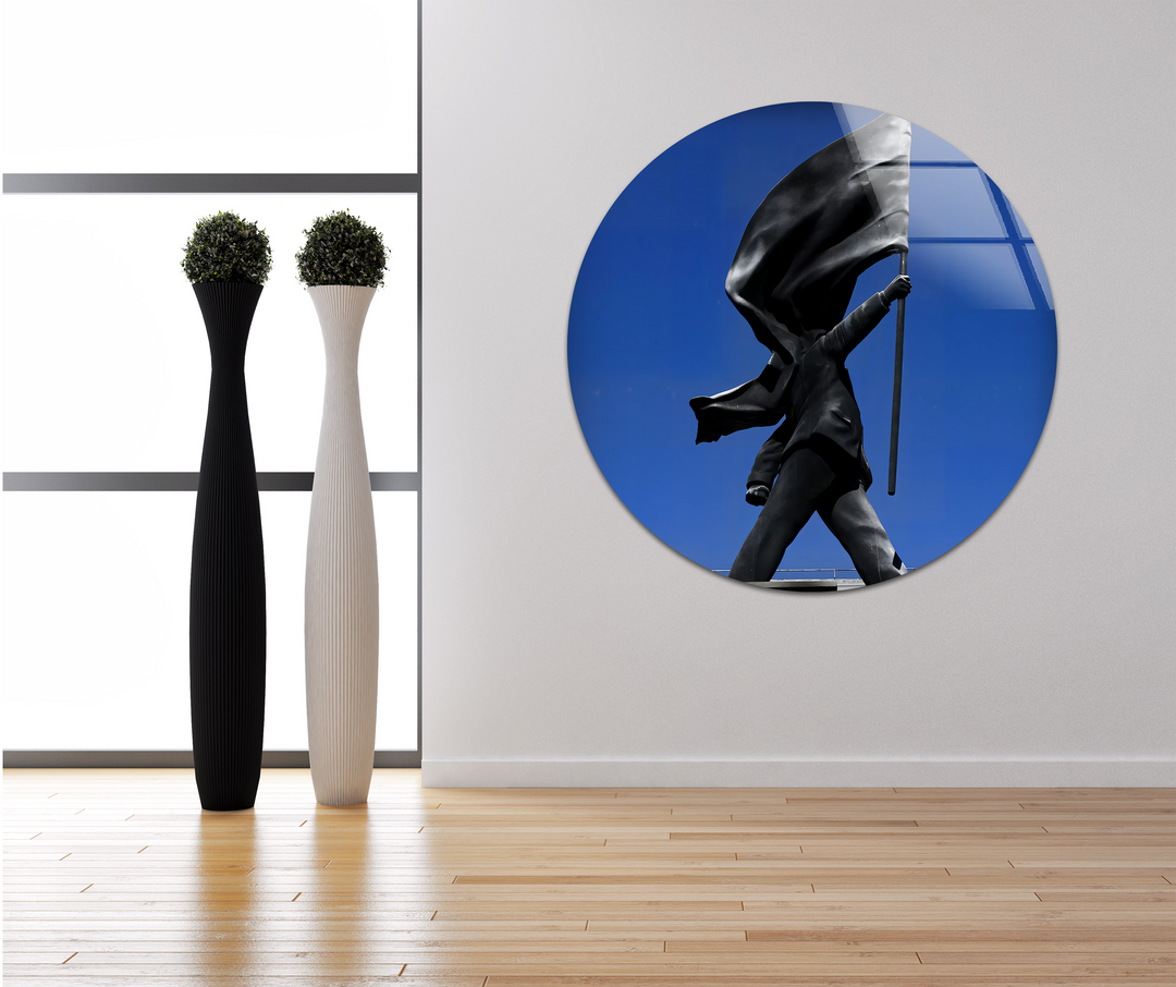 Brilliant white light streams through the expansive windows, illuminating a captivating Banksy Flag Statue print wall art with a deep blue background.