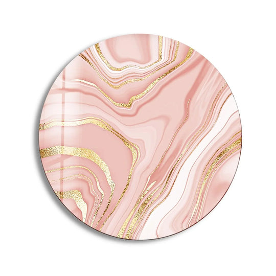 The visual rhythm of this pink abstract round art from glass creates an elegant swirl, accented by shimmering gold details.