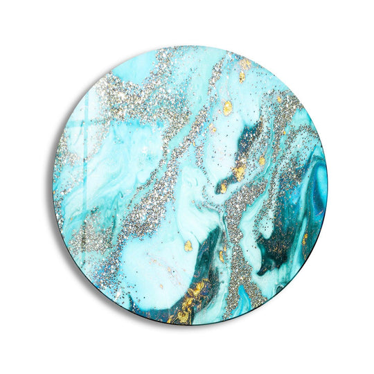Cool color temperature radiates from this blue marble glass wall art, offering a modern home decoration with shimmering silver and gold details.