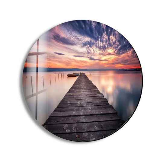 Showcasing the sleek edge and borders of this round glass hanging wall art, featuring a purple sunset lake view for a modern, serene aesthetic.