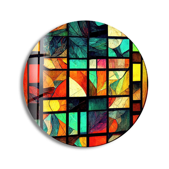 Organic forms dominate in this yellow and green stained round glass art featuring leaf-like patterns encased within the geometric panes of vibrant glass art.