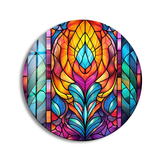 The focal point of the stained geometric design shows unique modern wall decor with vibrant hues of orange, yellow, blue, and purple in this round glass wall art.
