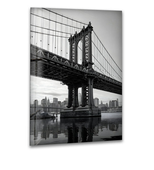 Illuminated by the bright sky, this Manhattan Bridge skyline glass wall art beautifully showcases a stunning black and white cityscape as one of our amazing wall prints.