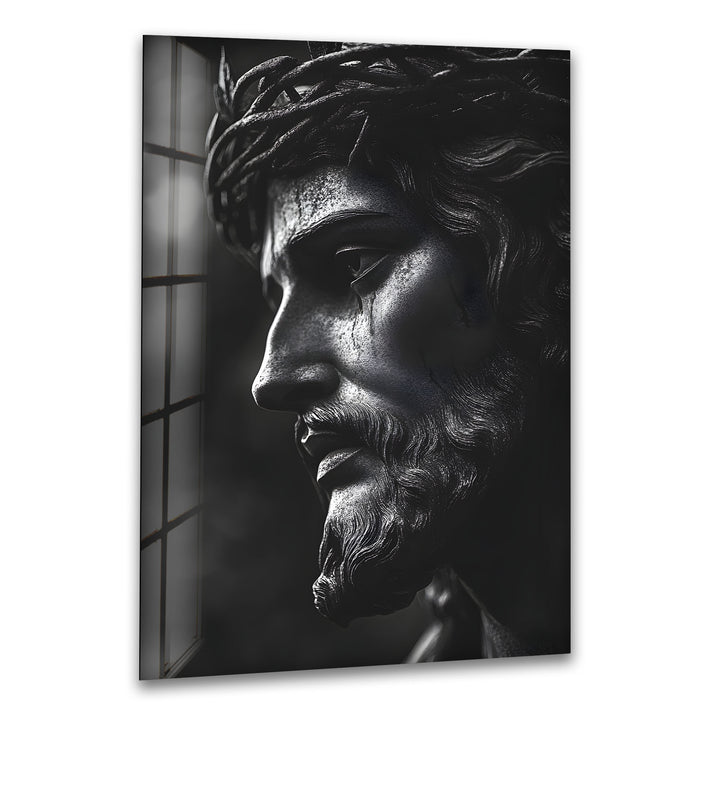 Powerful black-and-white depiction of Jesus sculpture on glass, exuding spiritual elegance.
