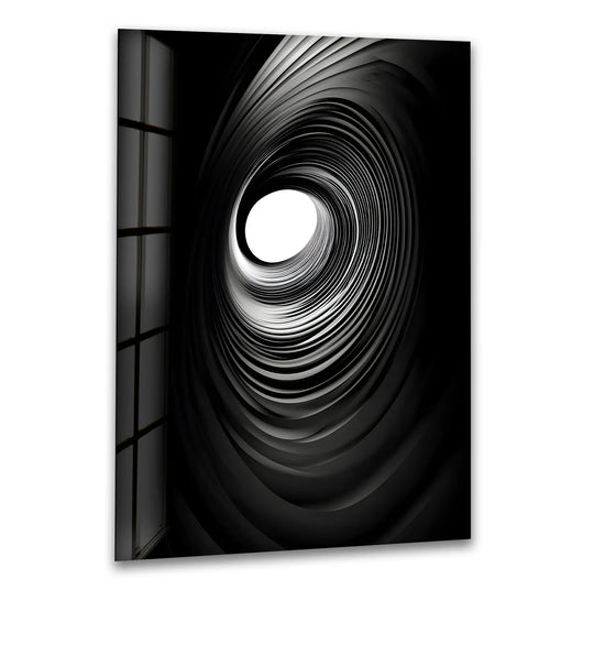 A premium glass wall art piece featuring a dramatic black-and-white spiral design, elevating any space with its modern home decor appeal.
