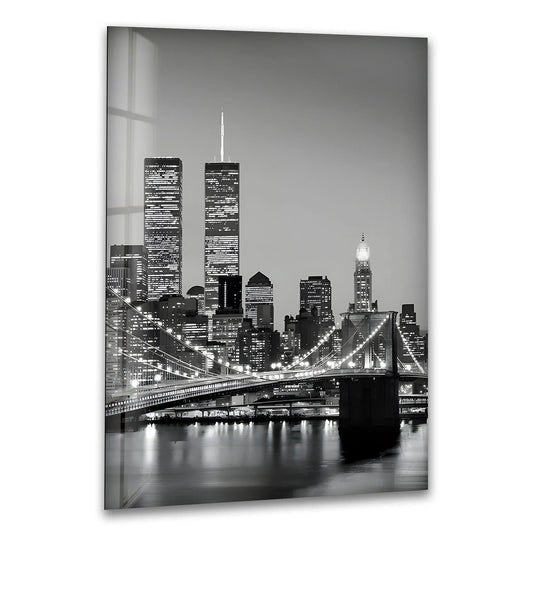 Brightest city lights illuminate the water under the Brooklyn Bridge and Manhattan skyline in this striking, unique modern wall decor.