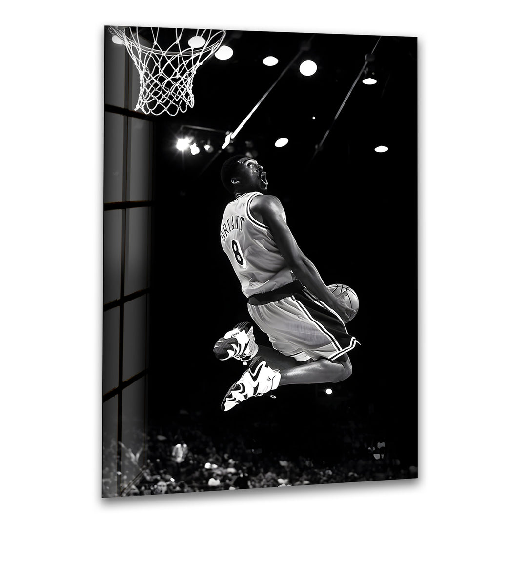 Experience the iconic moment of Kobe Bryant's powerful dunk captured in stunning black and white.