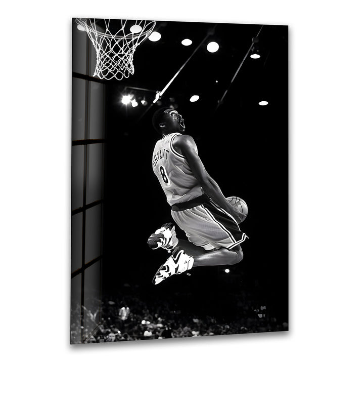 Experience the iconic moment of Kobe Bryant's powerful dunk captured in stunning black and white.