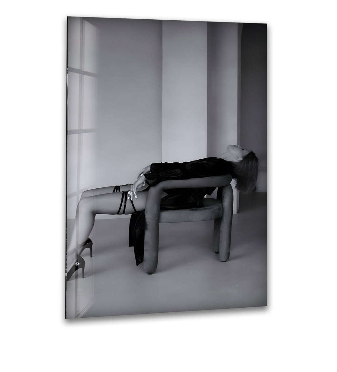 A sophisticated black and white glass wall art capturing the beauty and grace of a stylish woman.

