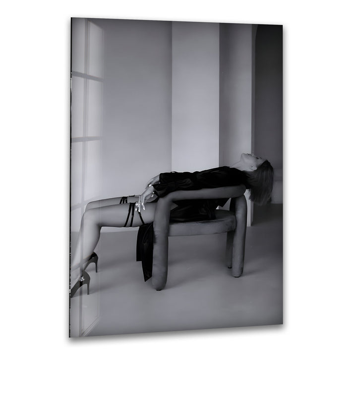 A sophisticated black and white glass wall art capturing the beauty and grace of a stylish woman.

