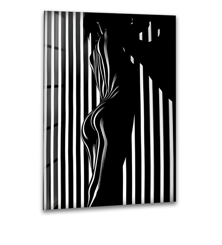 A striking black and white glass wall art featuring a bold abstract silhouette in high contrast.
