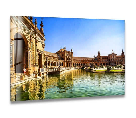 Capturing the layering effect through reflections on the water, this Seville glass wall art showcases the Plaza de España as exquisite home decor.