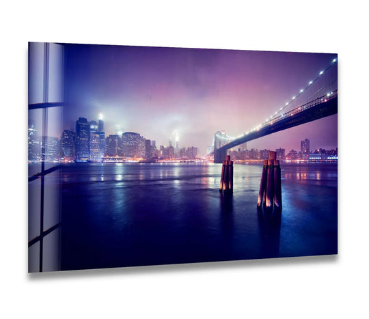 Gleaming Brooklyn Bridge lights, reflected intensely in the water, dominate this city prints glass wall art, adding drama to your home decor.