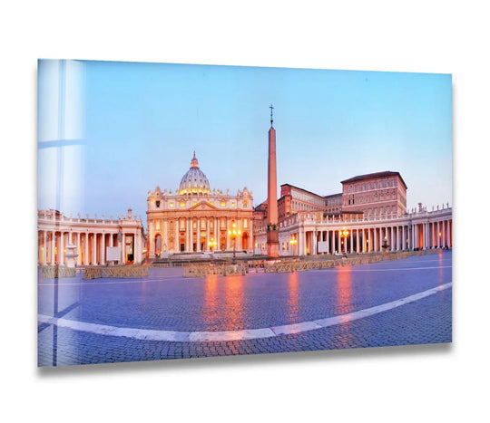 St. Peter's Square, the central subject of this Vatican City glass print wall art, captures a majestic view of the Basilica at dawn.