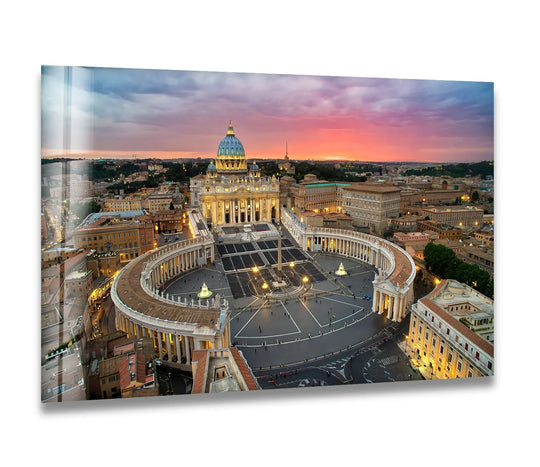 At the focal point, the iconic dome of St. Peter's Basilica glows in this Vatican City glass wall art decor, enhanced by the aerial view of the square at sunset.